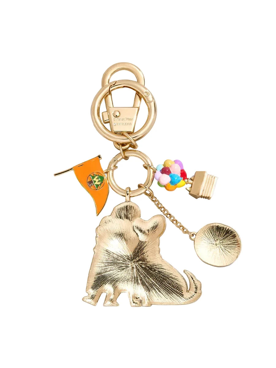 Gold keychain with various charms on a white background