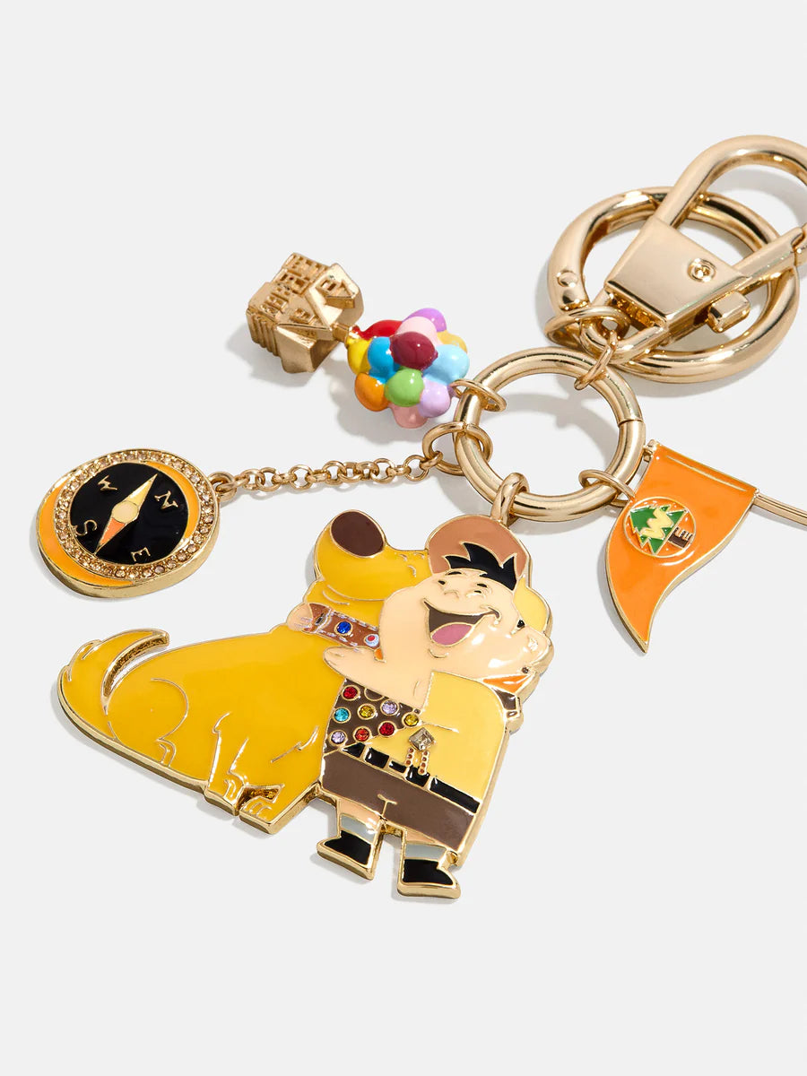 Keychain with cartoon character and various charms on a white background