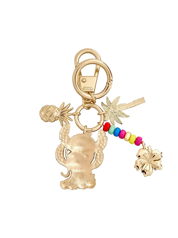 Gold keychain with various charms on a white background