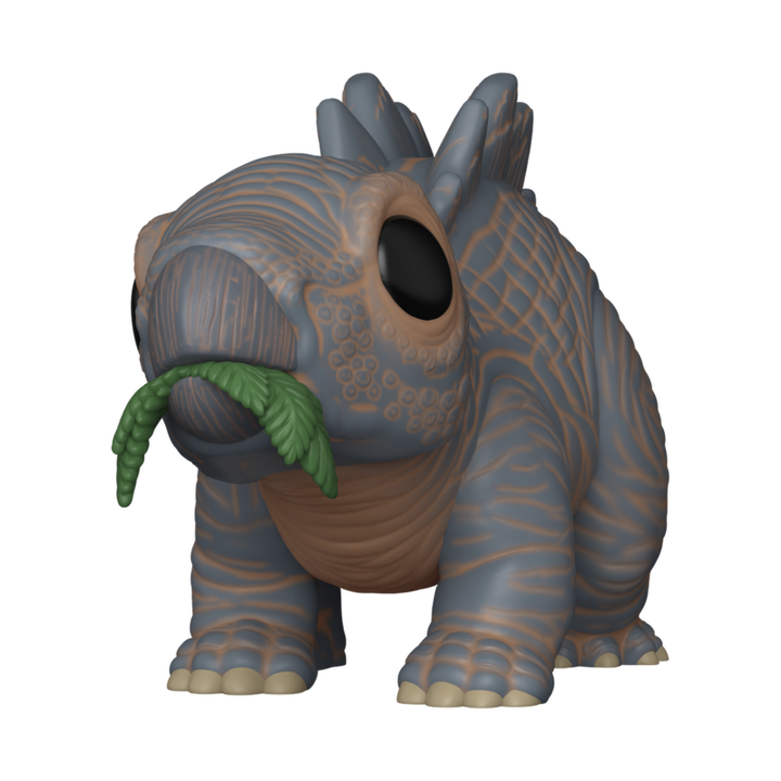 Toy figure of a prehistoric creature with a plant on a white background