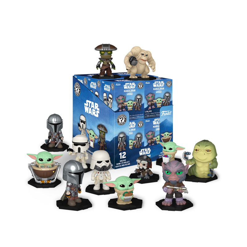 Collection of Star Wars figurines in front of a box set on a white background
