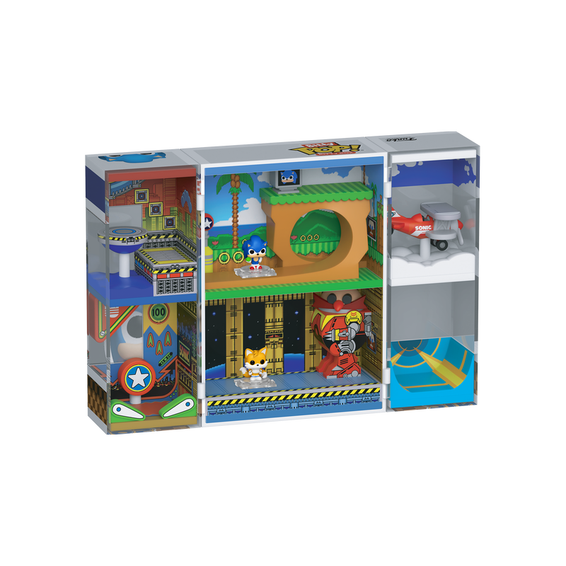 Toy playset packaging with various scenes and characters on a white background