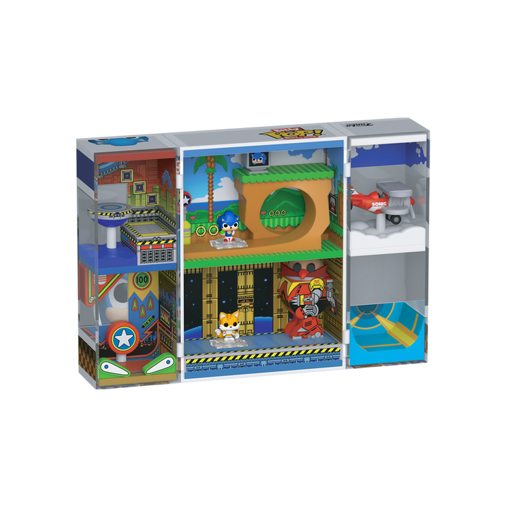Toy playset packaging with various scenes and characters on a white background