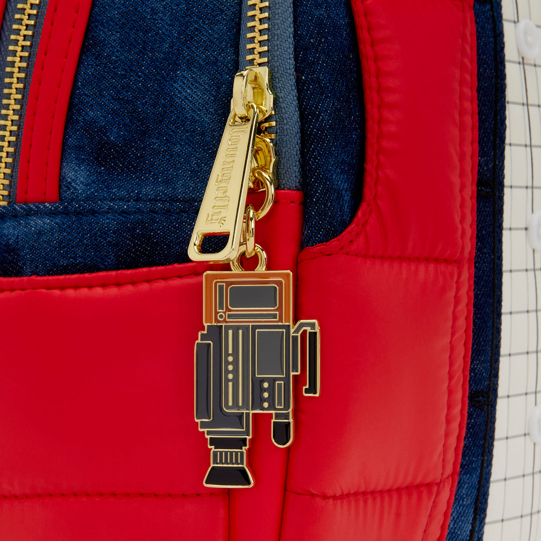 Robot keychain attached to a red and blue backpack