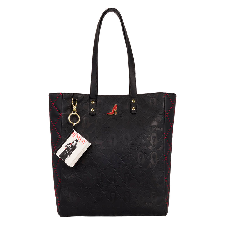 Black quilted handbag with a keychain and tag on a white background