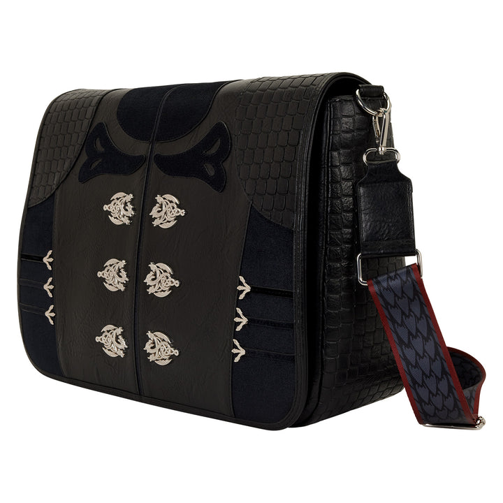 Black leather bag with silver emblem designs on a white background