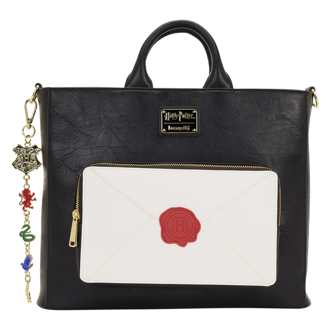 Black handbag with a white pocket featuring a red seal, Harry Potter logo, and charm strap on a white background.