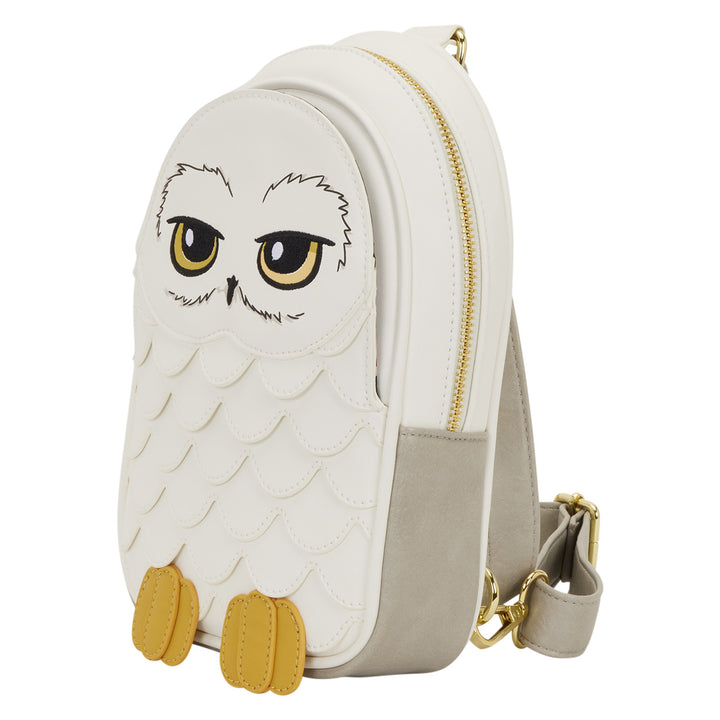 White owl-shaped backpack with gold accents on a white background