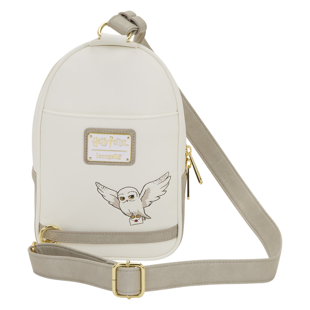 White backpack with owl design and gold accents on a white background