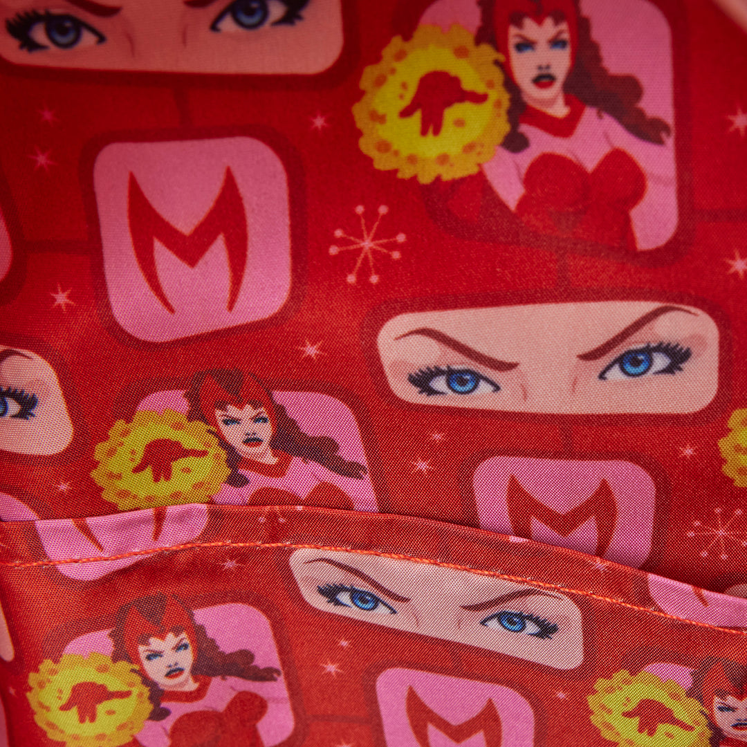 Red fabric with superhero-themed pattern featuring faces, 'M' logo, and star designs.