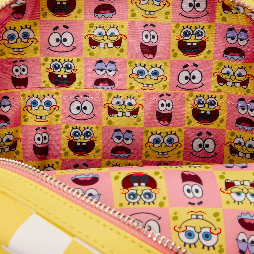 Spiral-bound notebook with a colorful pattern of cartoon characters on a pink background