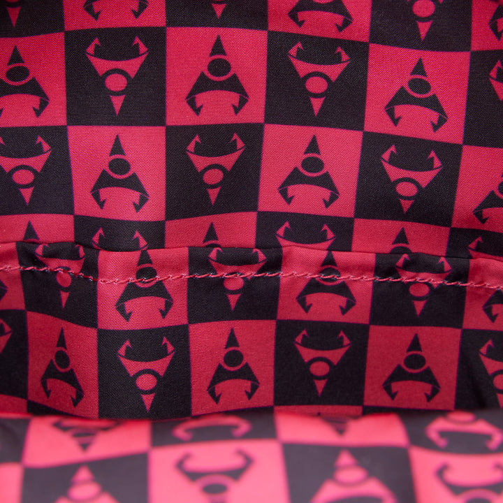 Red and black checkered pattern with a central logo on fabric