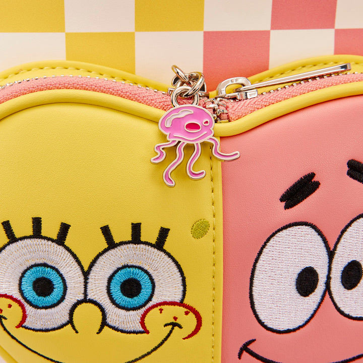 Two cartoon-themed pouches with a jellyfish charm on a checkered background