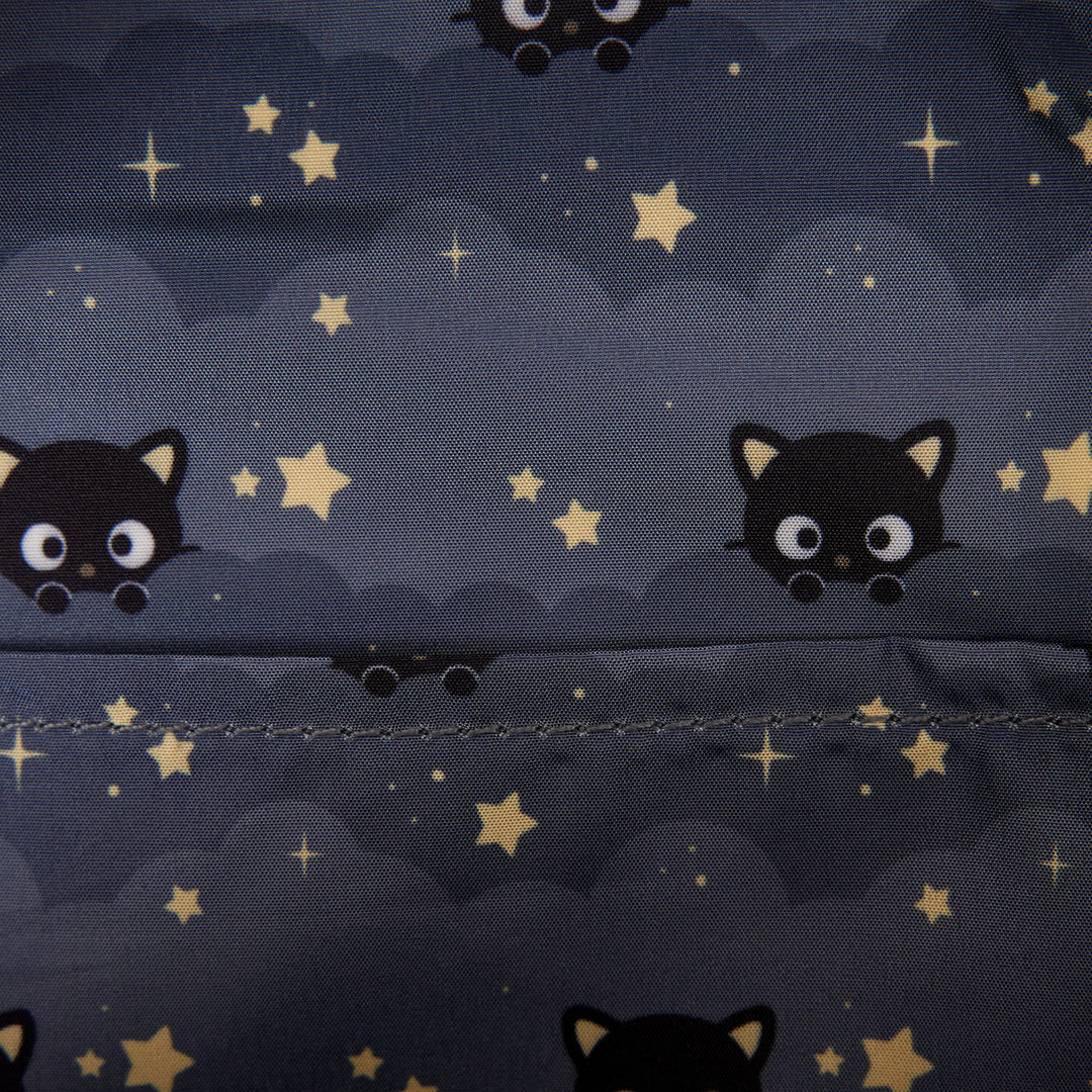 Pattern of black cats and stars on a dark blue background