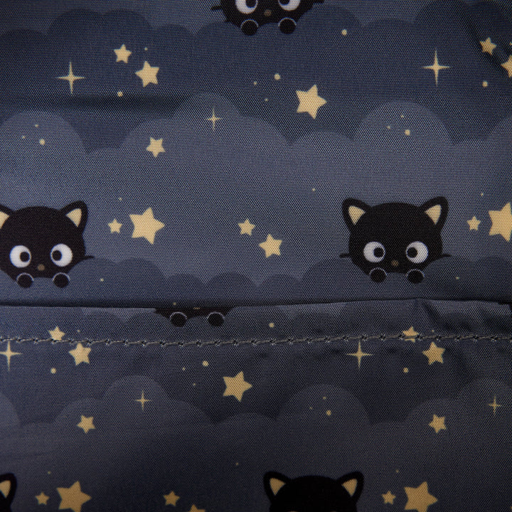 Pattern of black cats and stars on a dark blue background