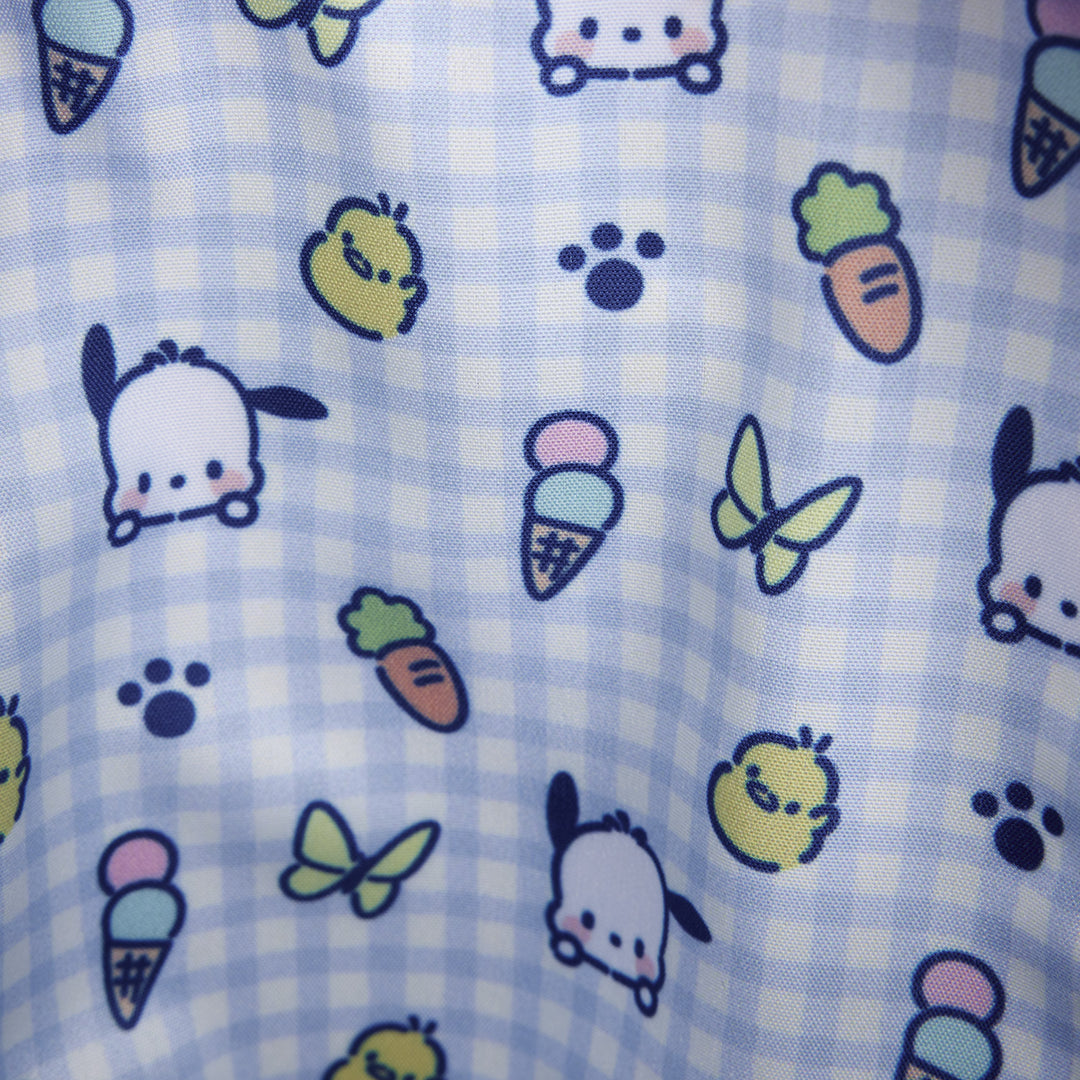 Patterned fabric with cartoon characters, ice cream cones, and butterflies on a checkered background.