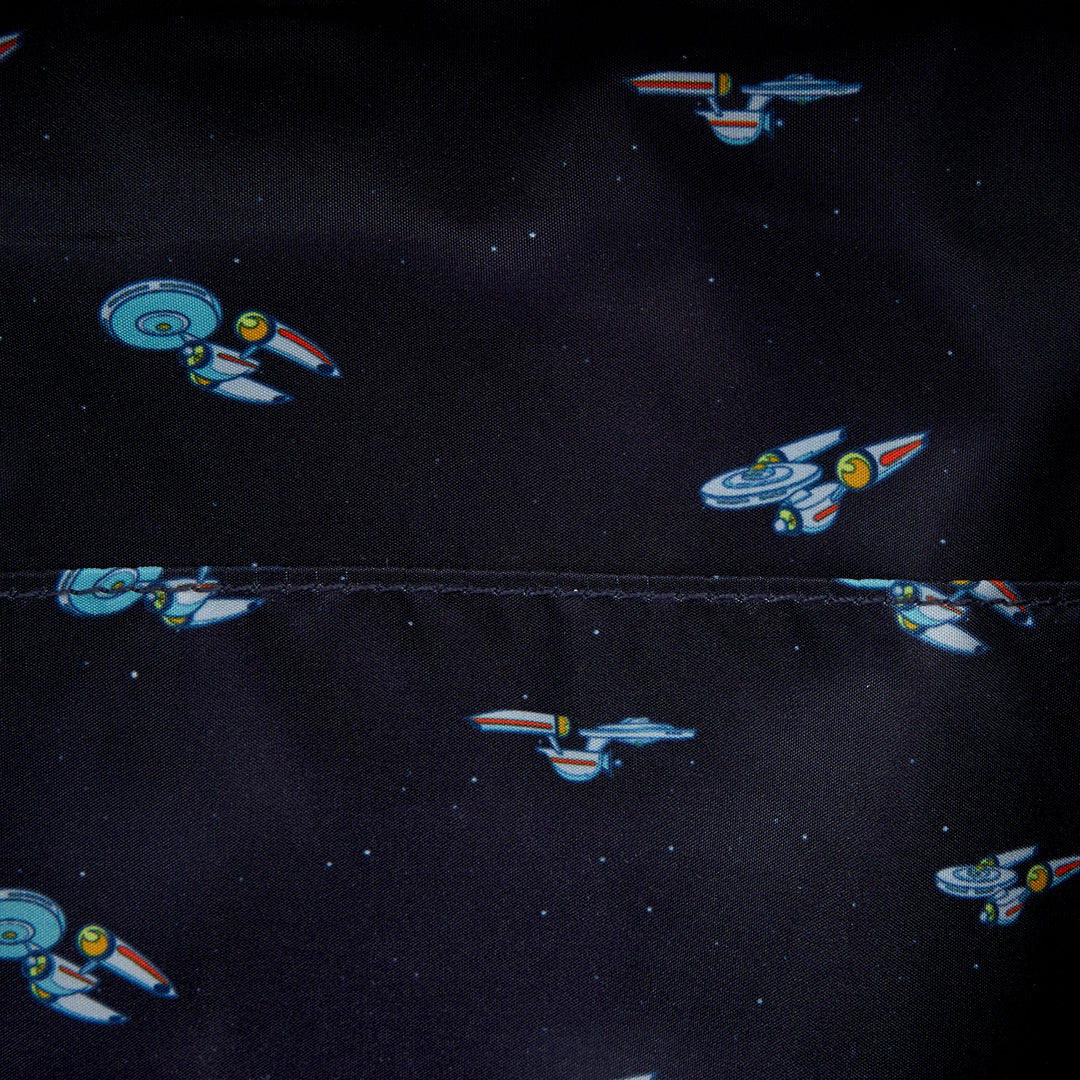 Pattern of space ships on a black fabric background