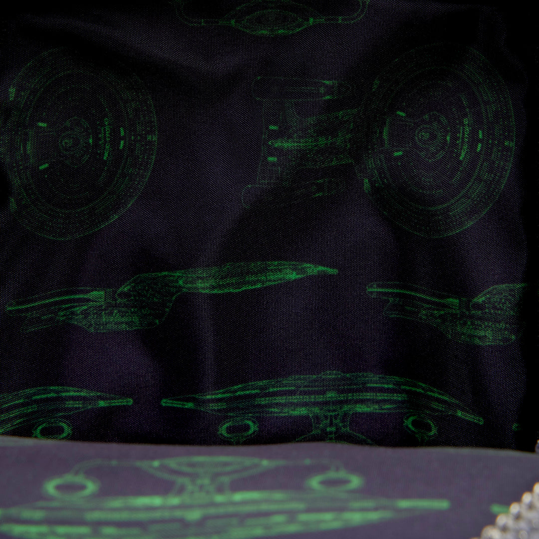 Navy blue fabric with green futuristic design patterns