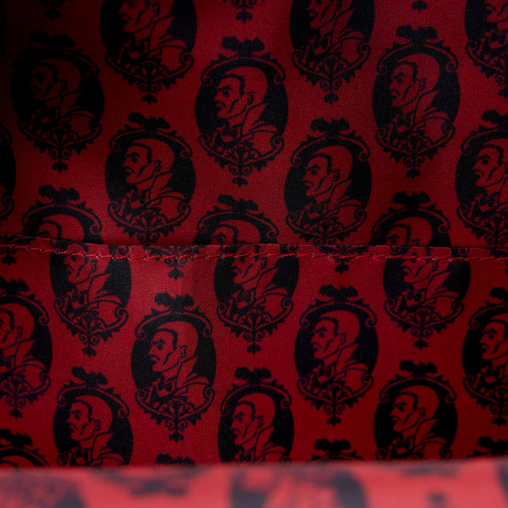 Red fabric with black vintage-style pattern of faces
