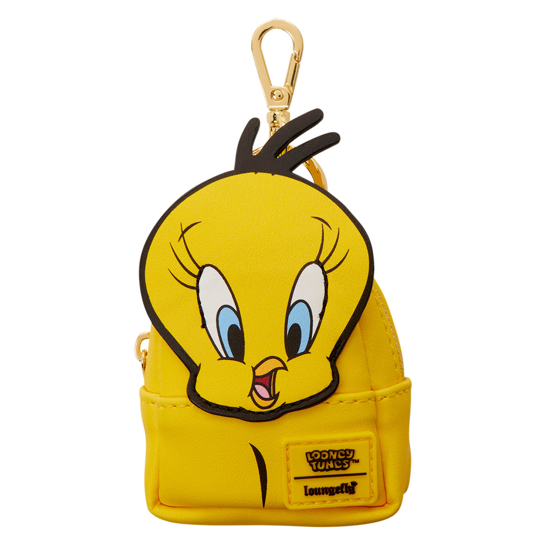 Yellow backpack keychain with cartoon character face on a white background
