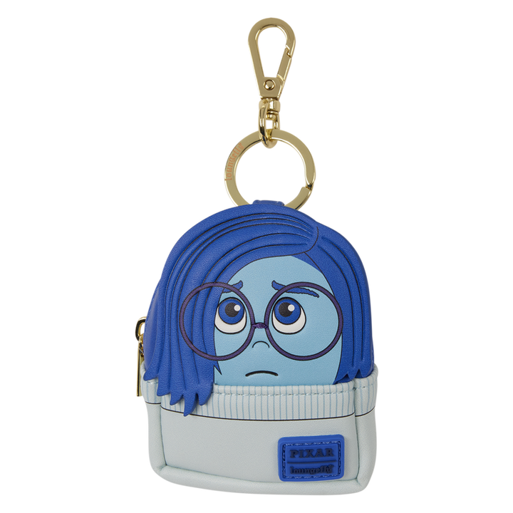 Keychain with a character design featuring blue hair and glasses on a white background
