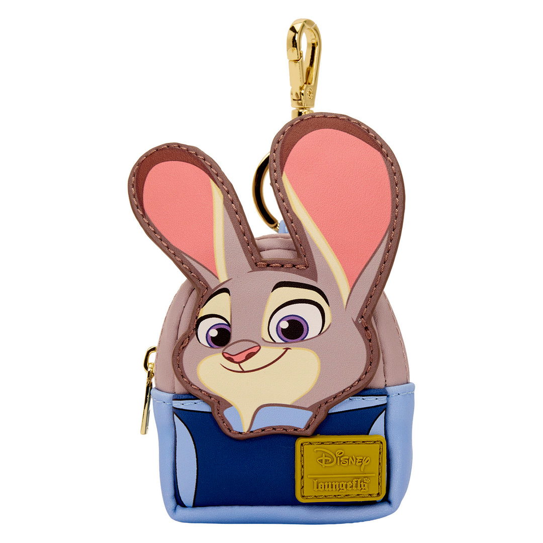 Character keychain with a smiling face, pink ears, and a blue pouch on a white background.