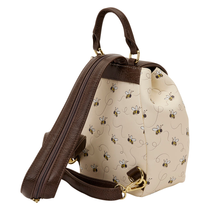Backpack with brown straps and a patterned beige front panel on a white background