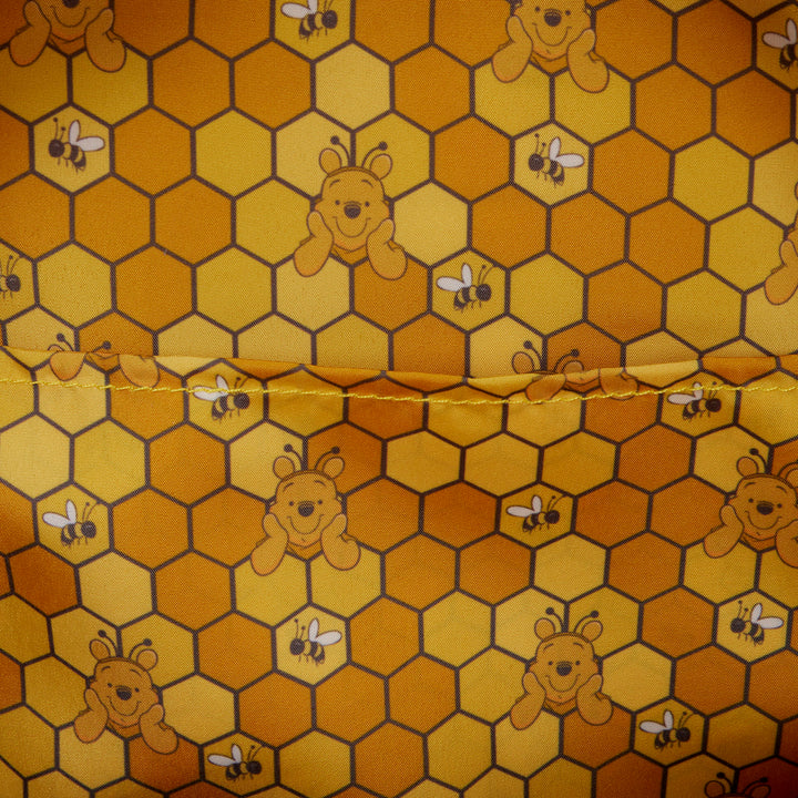 Fabric with honeycomb pattern featuring bears and bees on a yellow background