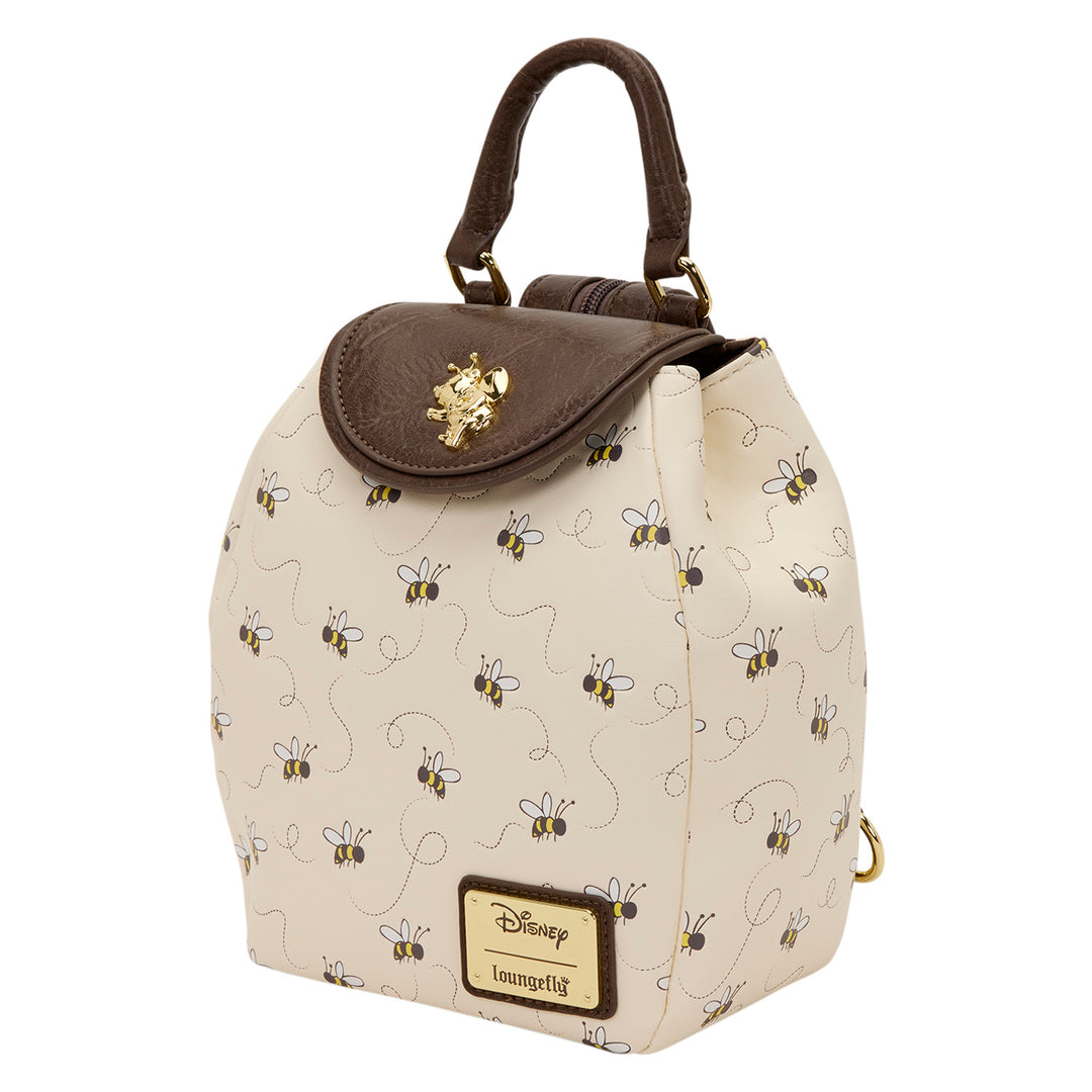 Beige backpack with bee pattern and brown top section on a white background