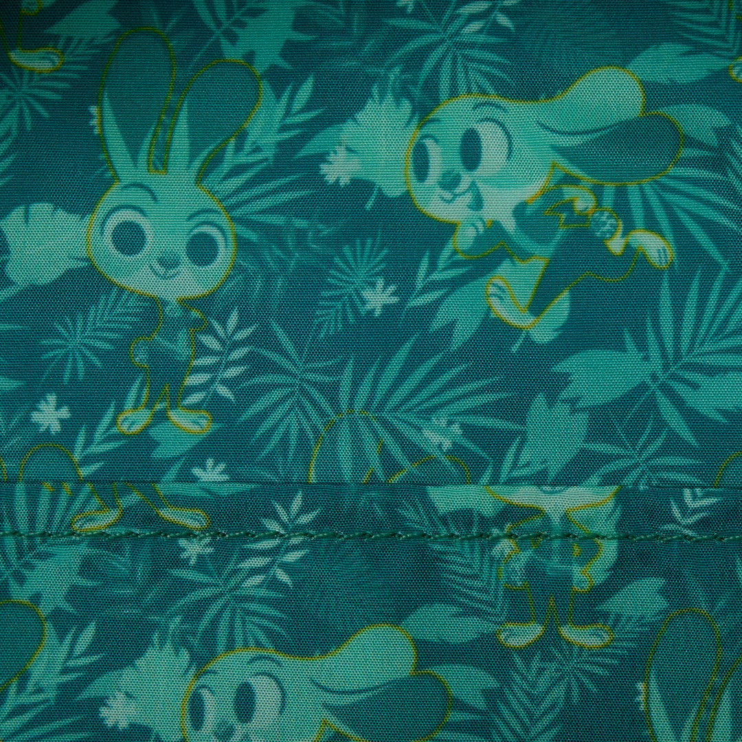 Fabric with cartoon rabbit and leaf pattern on a teal background