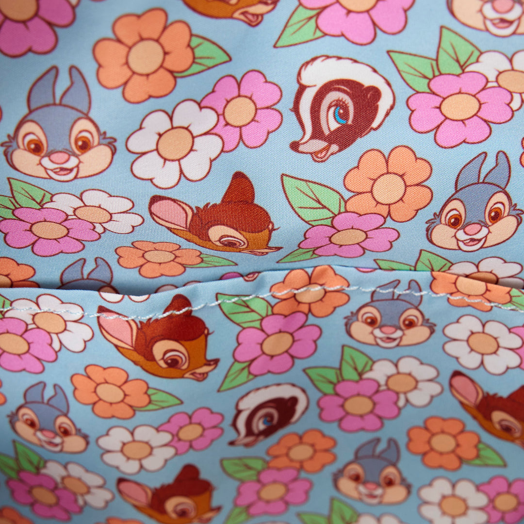 Fabric with cartoon characters and flowers on a blue background