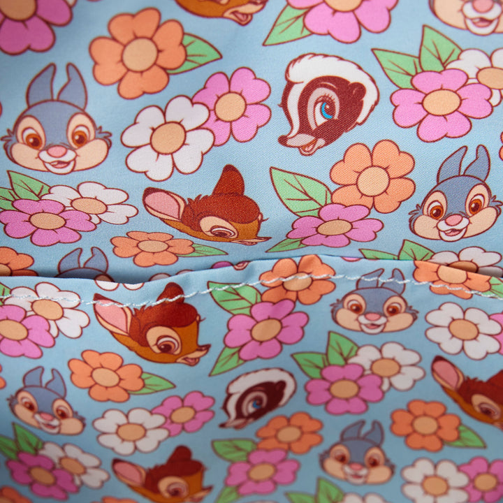 Fabric with cartoon characters and flowers on a blue background