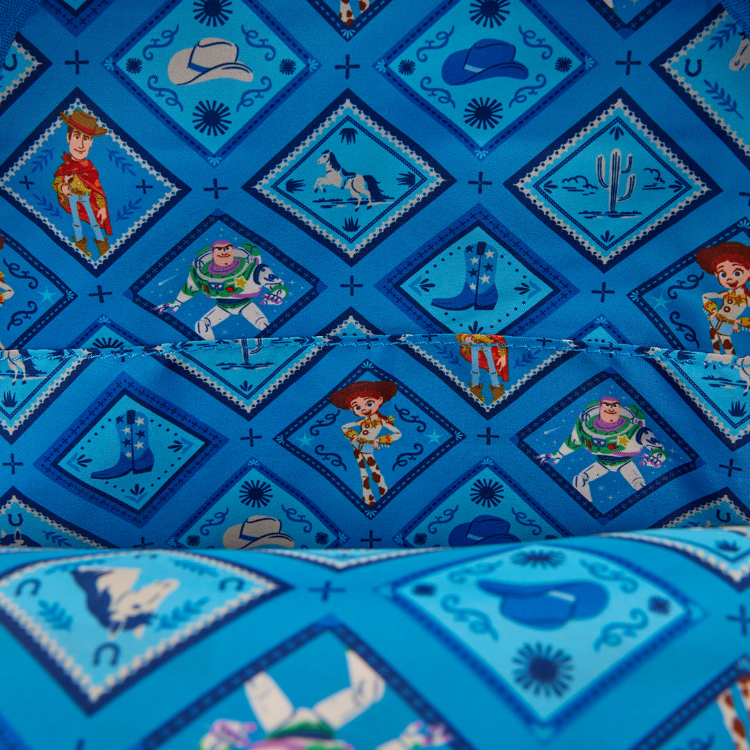Blue fabric with cartoon character patterns, including Woody, Buzz Lightyear, and Jessie from Toy Story.