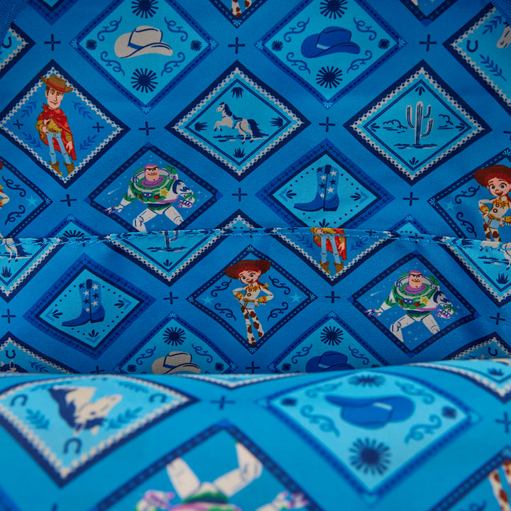 Blue fabric with cartoon character patterns, including Woody, Buzz Lightyear, and Jessie from Toy Story.