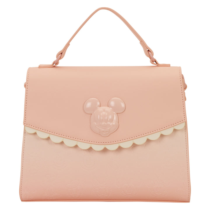 Pink handbag with a character face design on a white background
