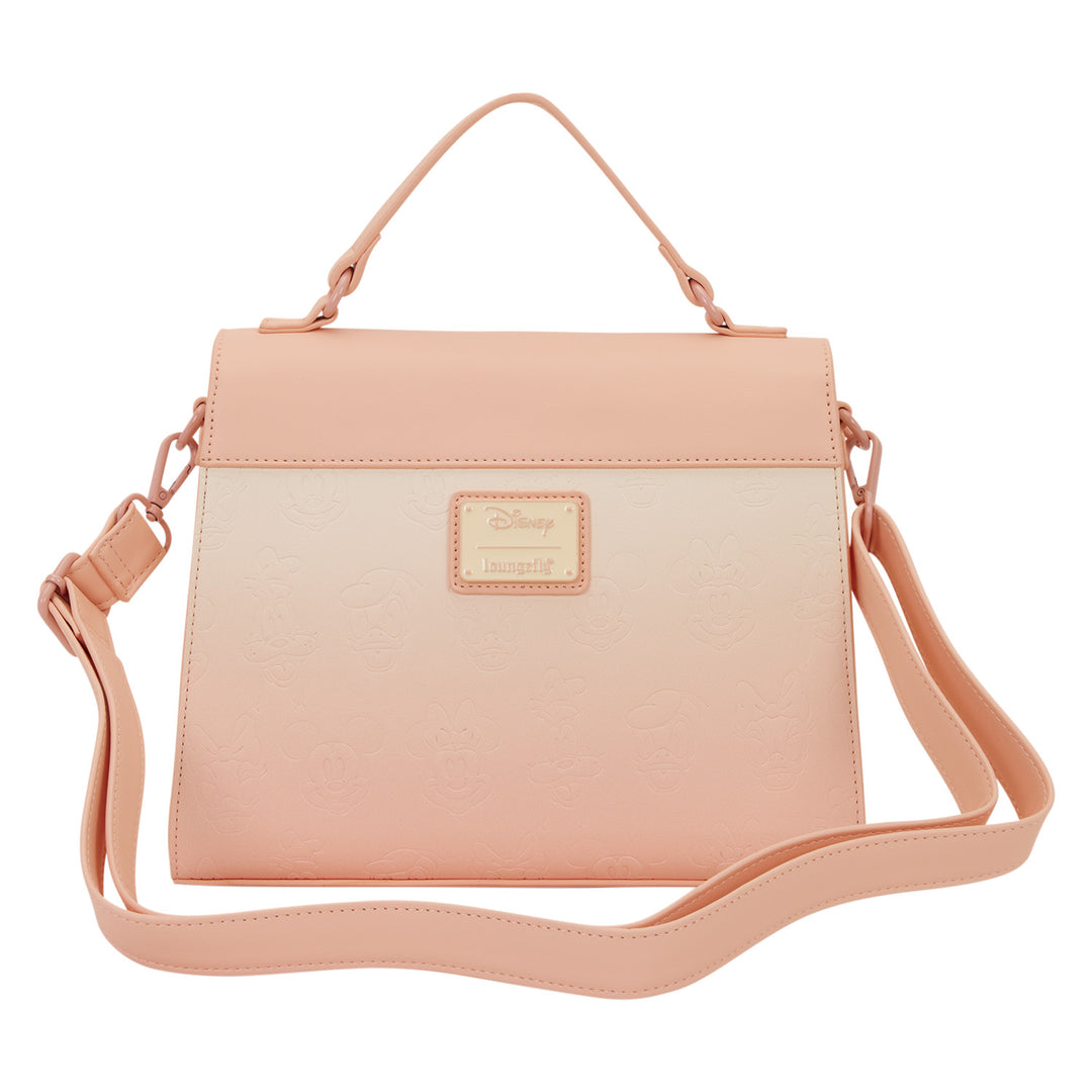 Pink crossbody bag with a visible brand logo on a white background