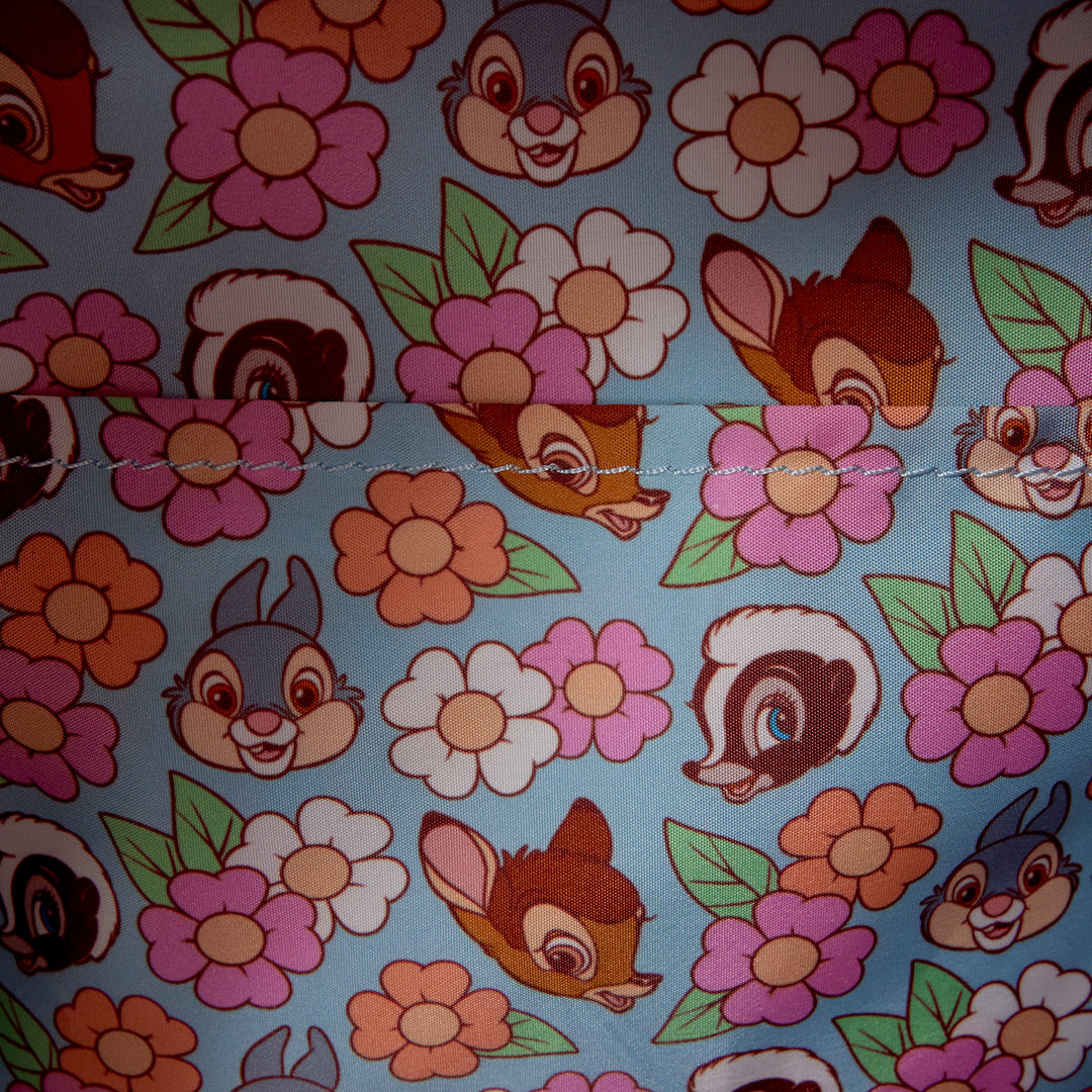 Pattern of cartoon characters and flowers on a blue background