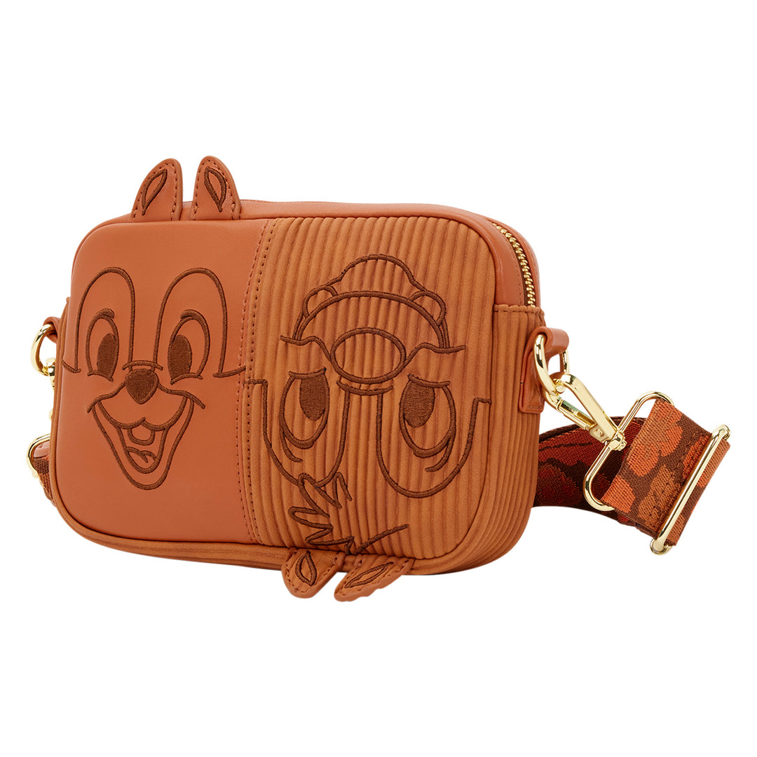 Brown crossbody bag with cartoon character faces on a white background