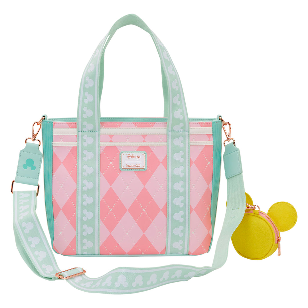 Pink and green patterned handbag with a matching coin purse on a white background
