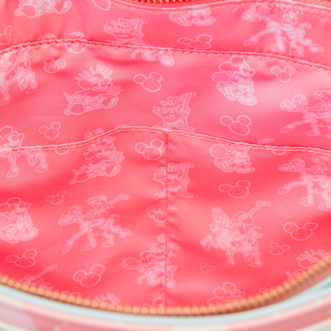 Close-up of a pink fabric with white cartoon character patterns