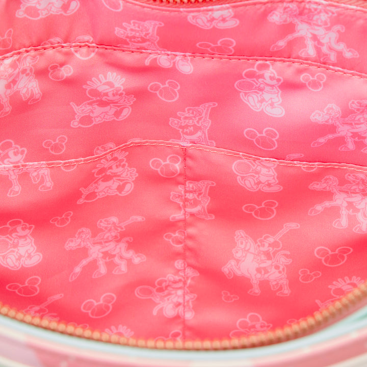 Close-up of a pink fabric with white cartoon character patterns