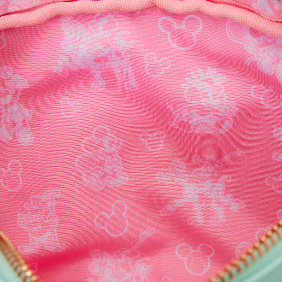 Pink fabric with white cartoon character prints on a pink background