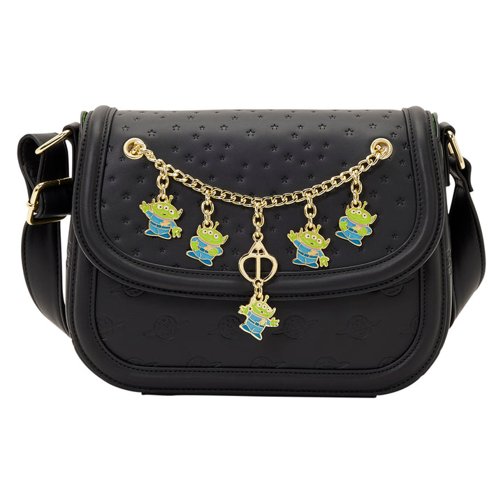 Black handbag with gold chain and character charms on a white background
