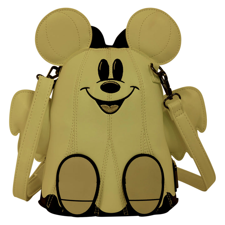 A light beige faux-leather crossbody bag shaped like a cartoon mouse character, featuring large round ears, a smiling face with black embroidered details, and two circular feet at the bottom, shown on a plain white background.