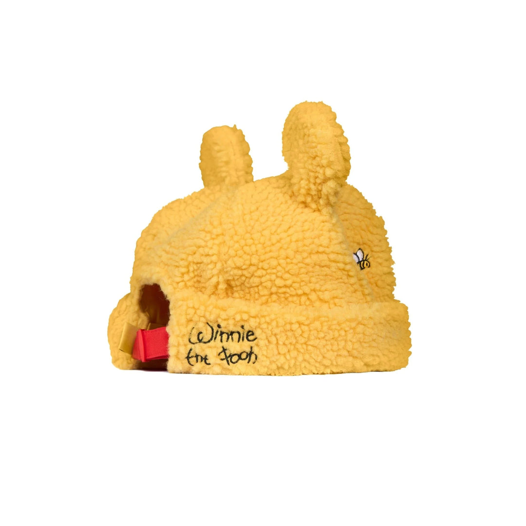 Yellow fleece pet house with 'Winnie the Pooh' branding on a white background