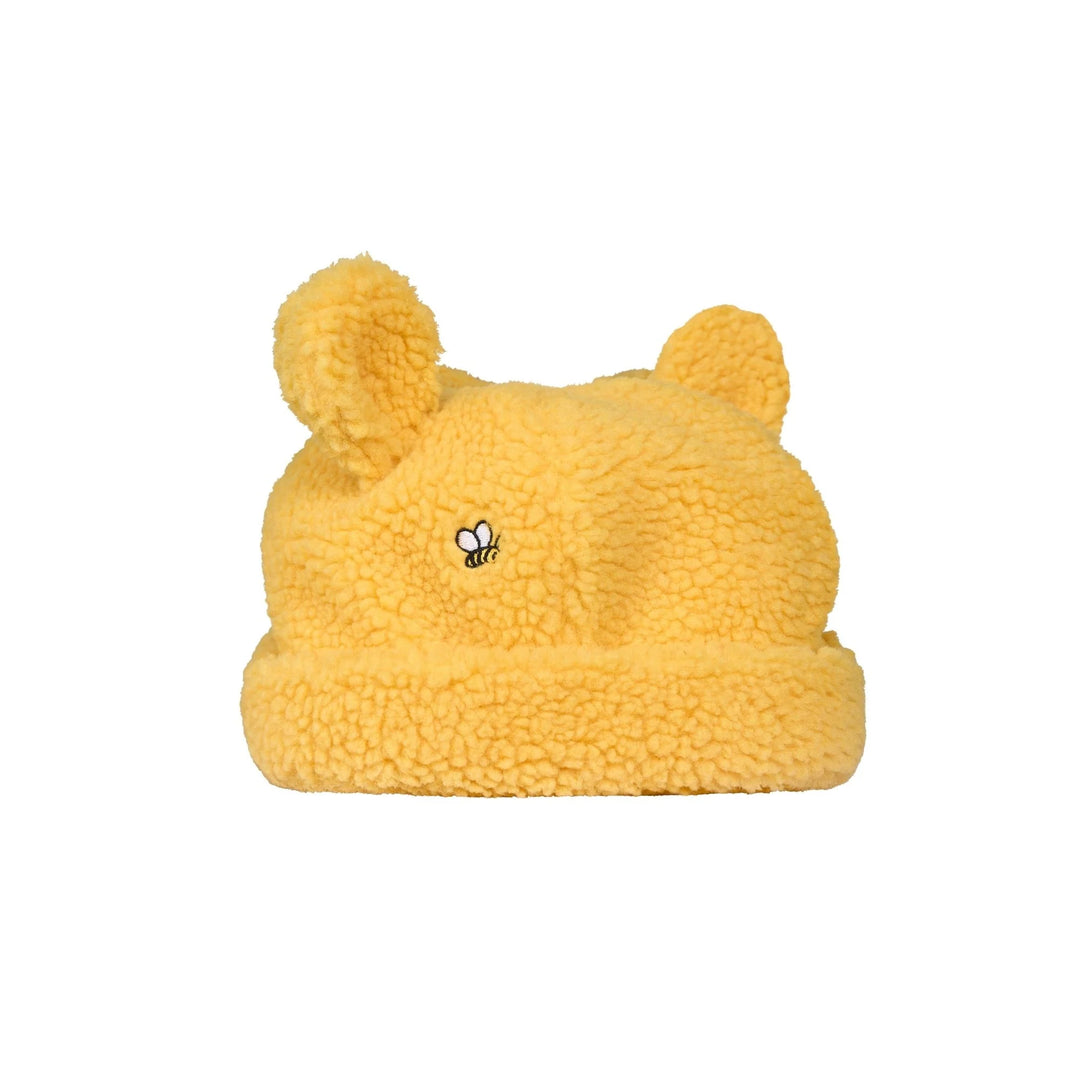 Yellow fleece beanie with bear ears and a bee emblem on a white background