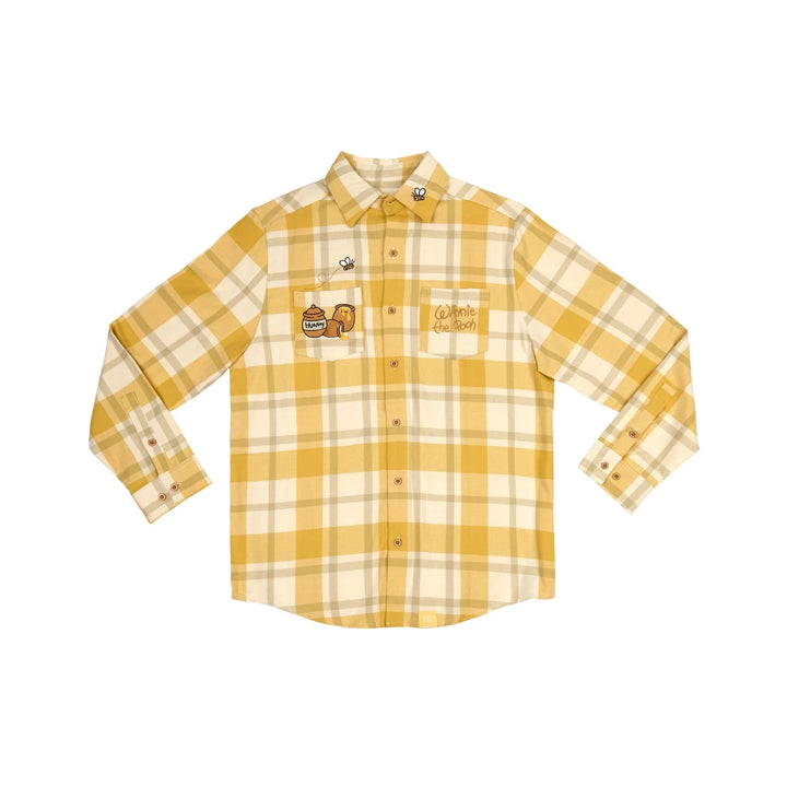Yellow and beige plaid shirt with embroidered design on a white background
