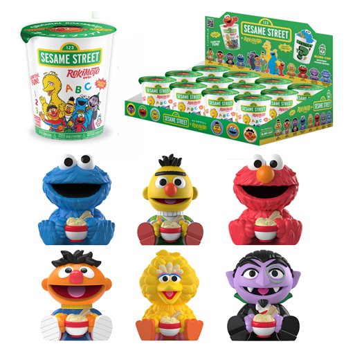 Sesame Street toys and packaging on a white background