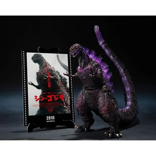  Godzilla figurine with a movie poster in the background
