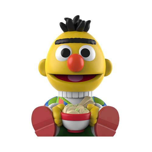 Toy figure of a character from Sesame Street holding a bowl of noodles.